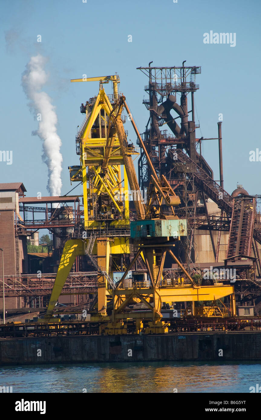 Cranes and industrial machinery at Piombino Port, Italy. Stock Photo