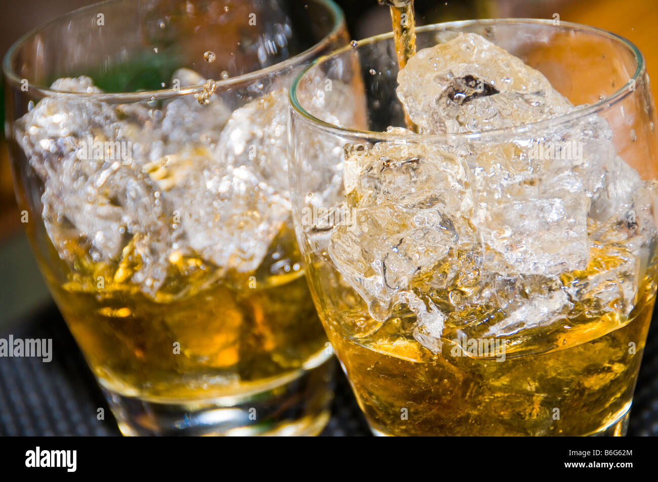 Rum and coke on ice closeup Stock Photo Alamy
