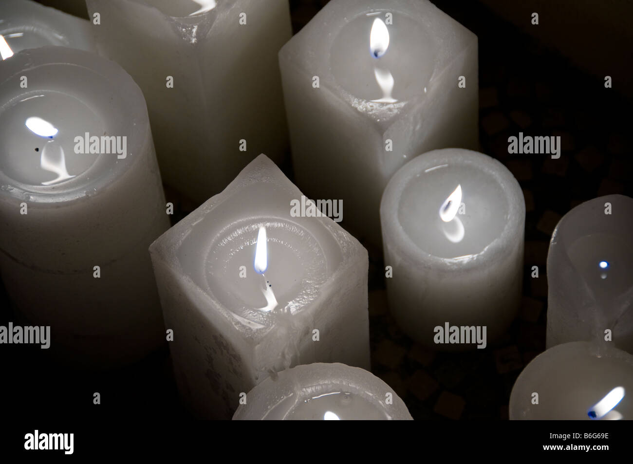 Closeup of lit white candles Stock Photo Alamy