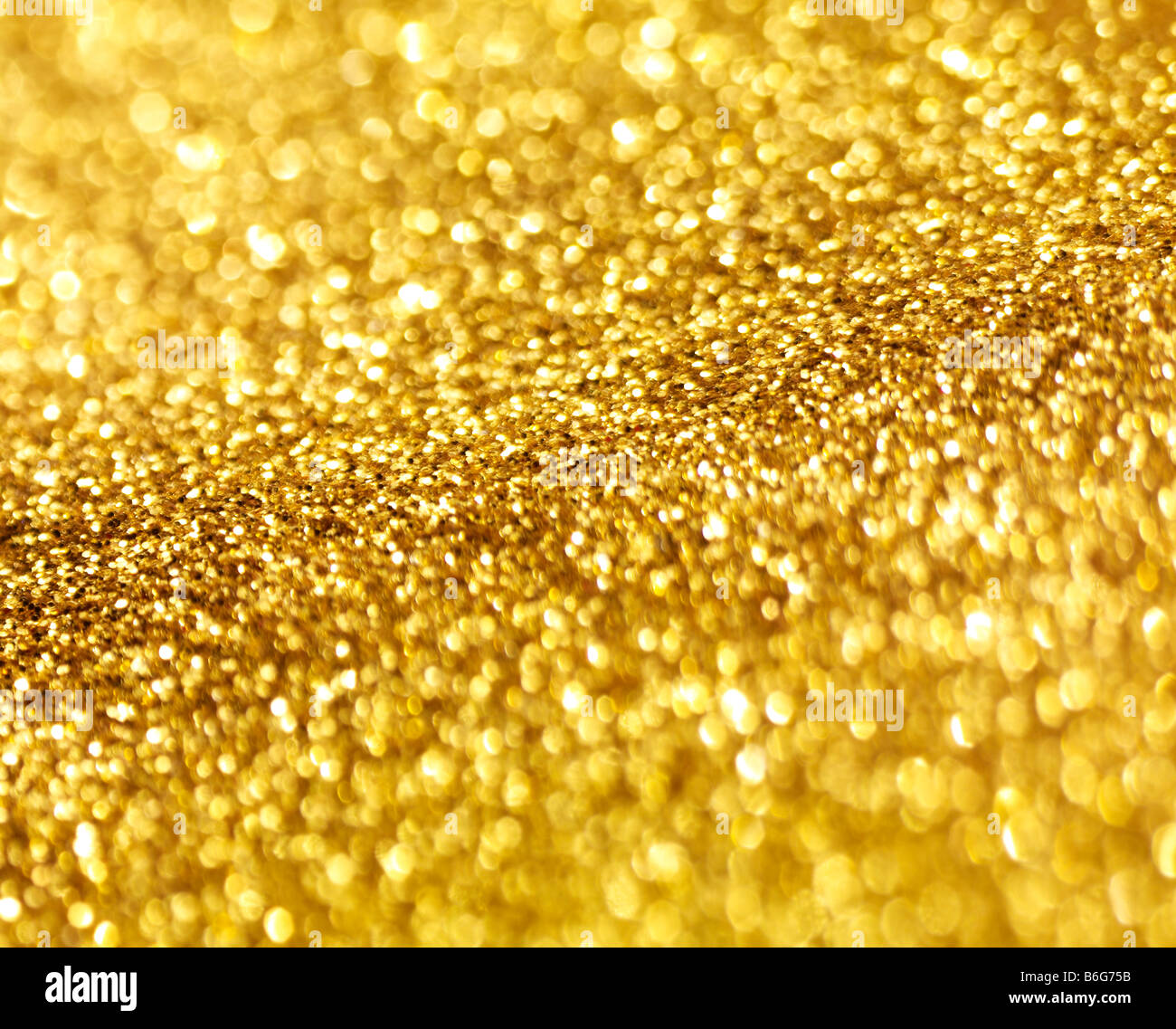 gold sparkly background short depth of field blurry sharp Stock Photo
