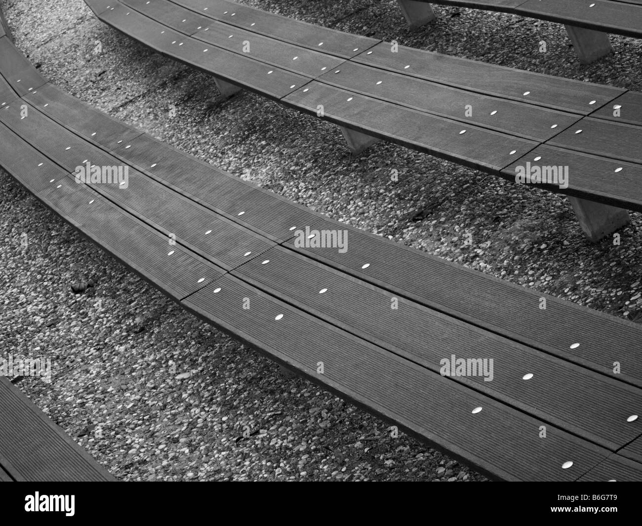 Curved wooden benches in Bundek park in Zagreb, Croatia. Stock Photo