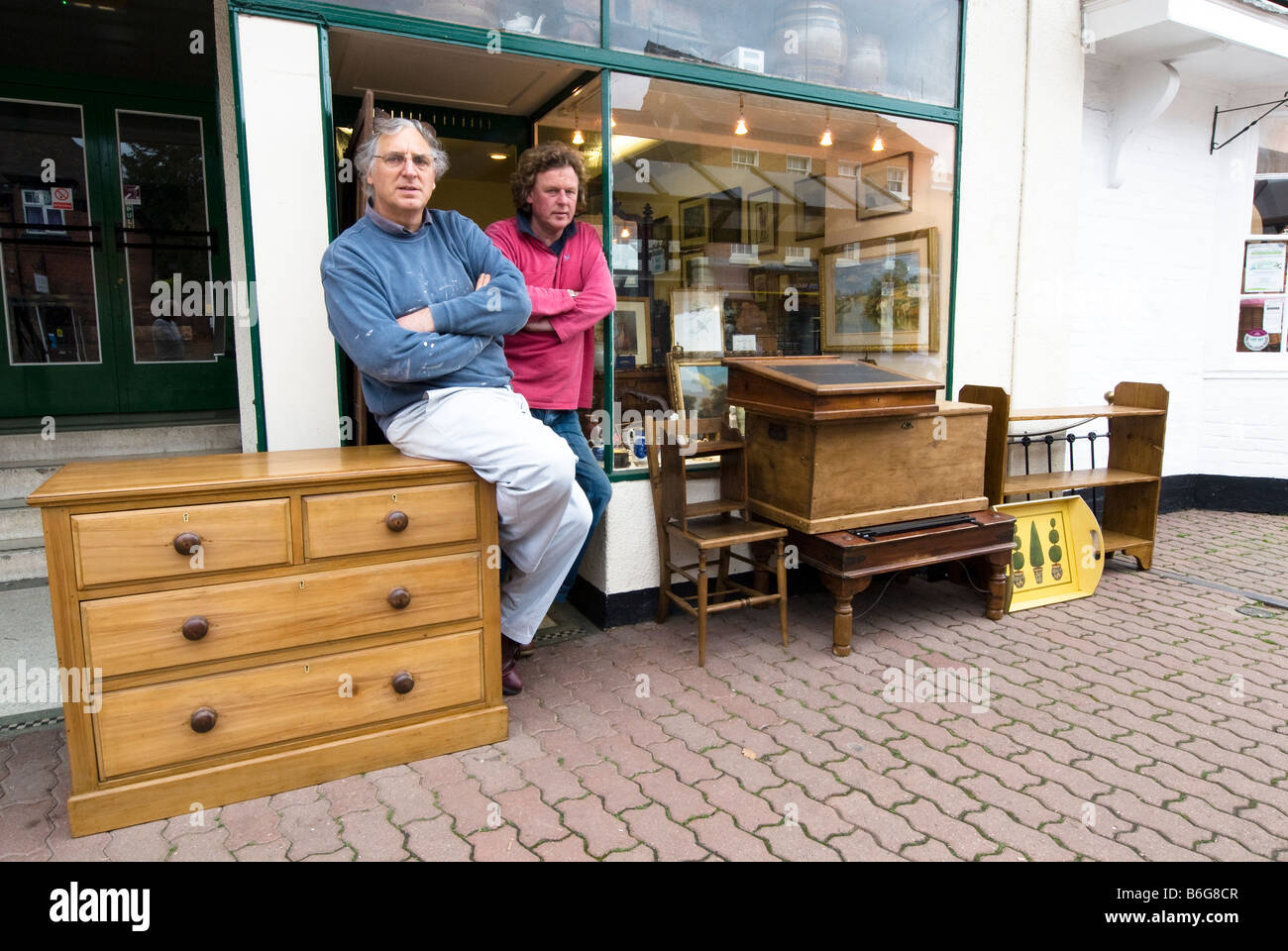 Owner of an antique shop stood outside his shop in Tenbury Wells Worcestershire Stock Photo Alamy