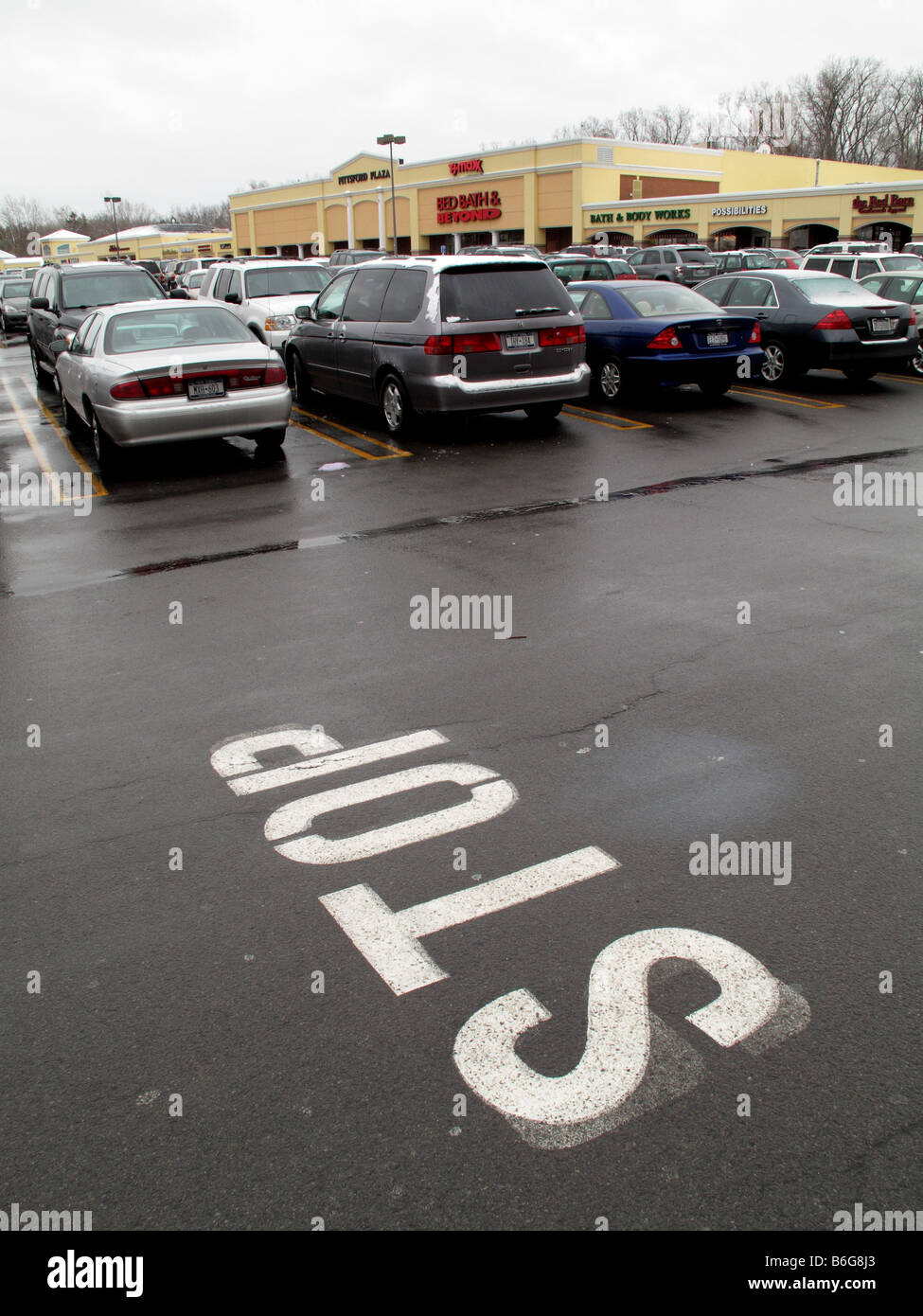 Stop sign at mall parking lot Stock Photo - Alamy