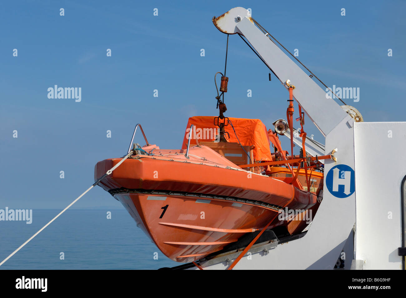Orange shipboard lifeboat Stock Photo Alamy