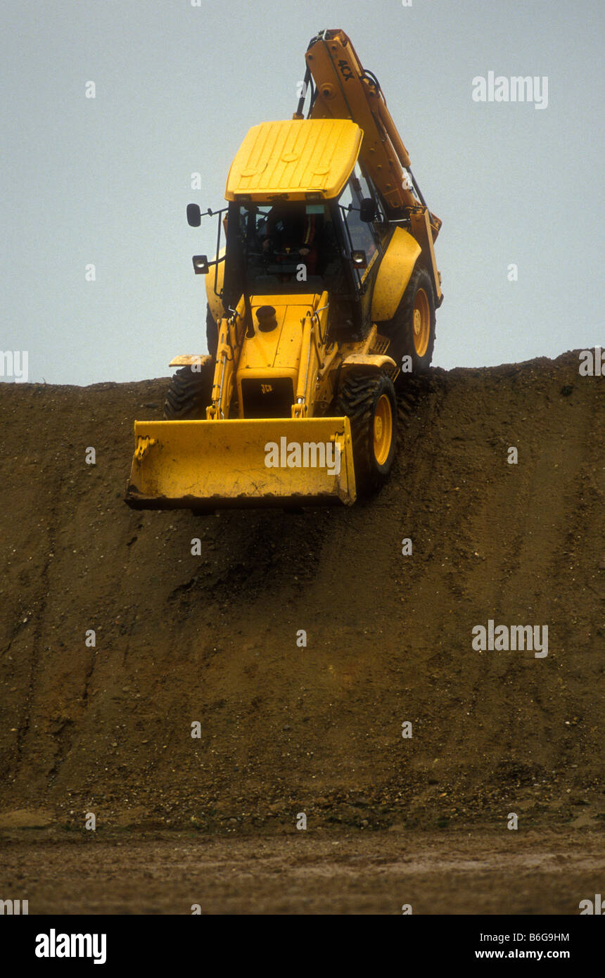 JCB digger working on construction site Stock Photo