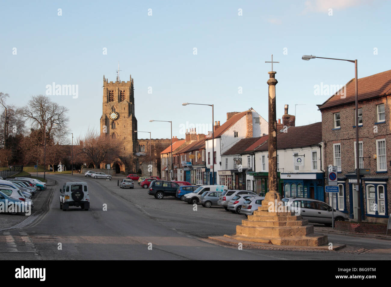 Bedale high street with 14th century market cross and St Gregory s ...