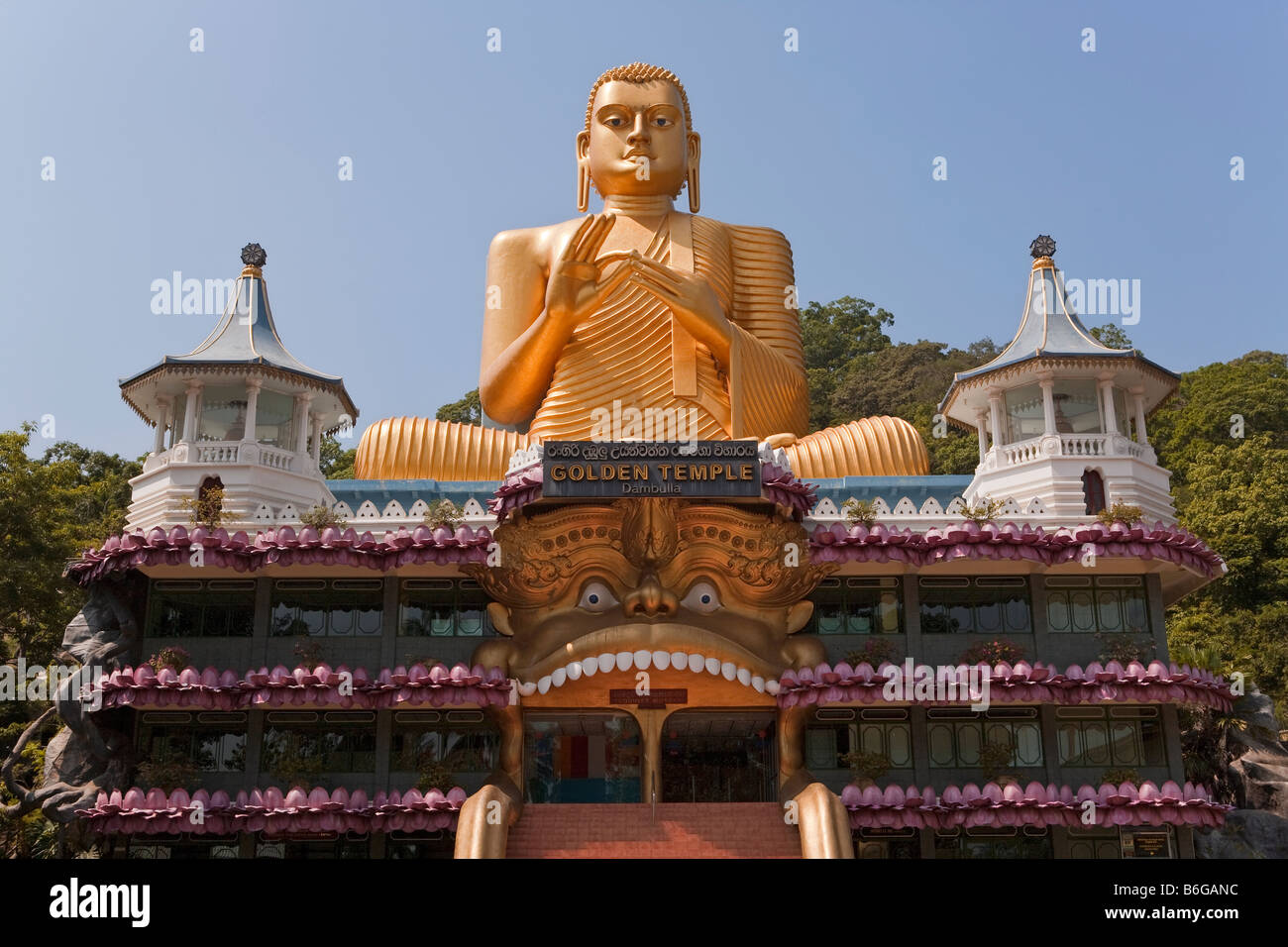 Giant gold seated Buddha statue at entrance to the Cave Temples, Golden
