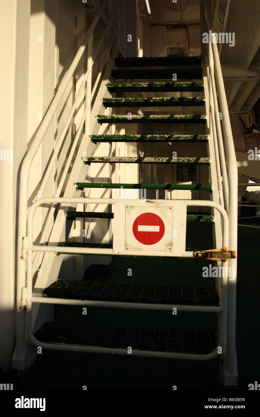 Stop sign on stairs of a ship Stock Photo Alamy