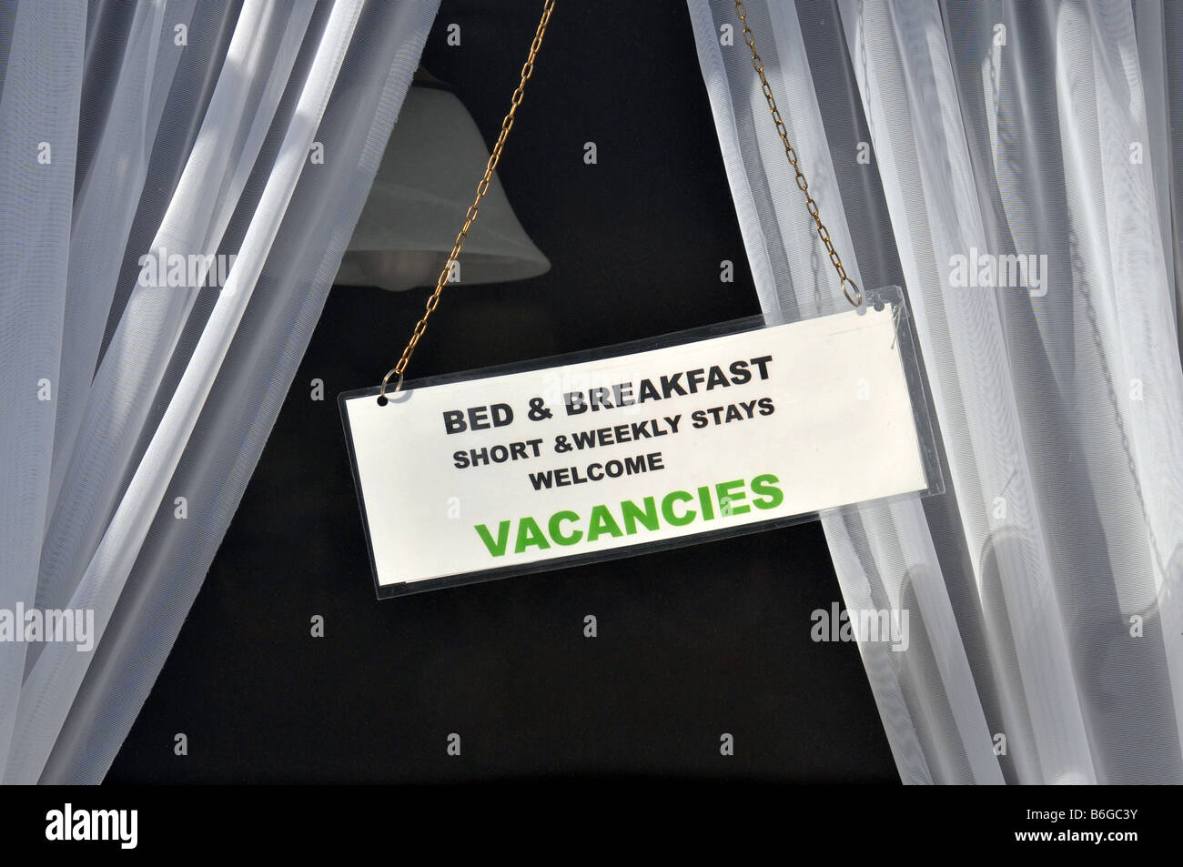 Vacancies sign in hotel window, Britain, UK Stock Photo Alamy