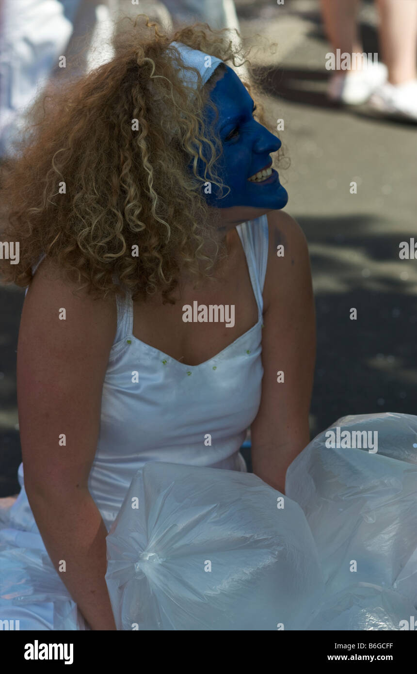 Girl with blue face mask and white dress Stock Photo