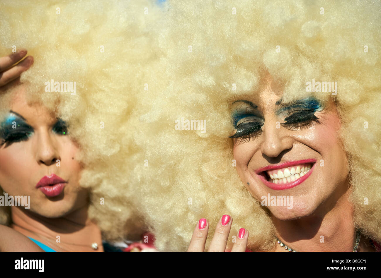 Christopher Street Day Berlin Man (Two men) Dressed as Woman (women) with Blond Wig and Heavy Makeup Stock Photo