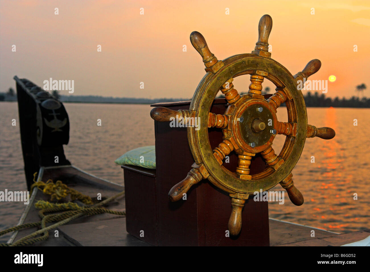 Steering wheel of traditional Kettuvallam houseboat in the Backwaters