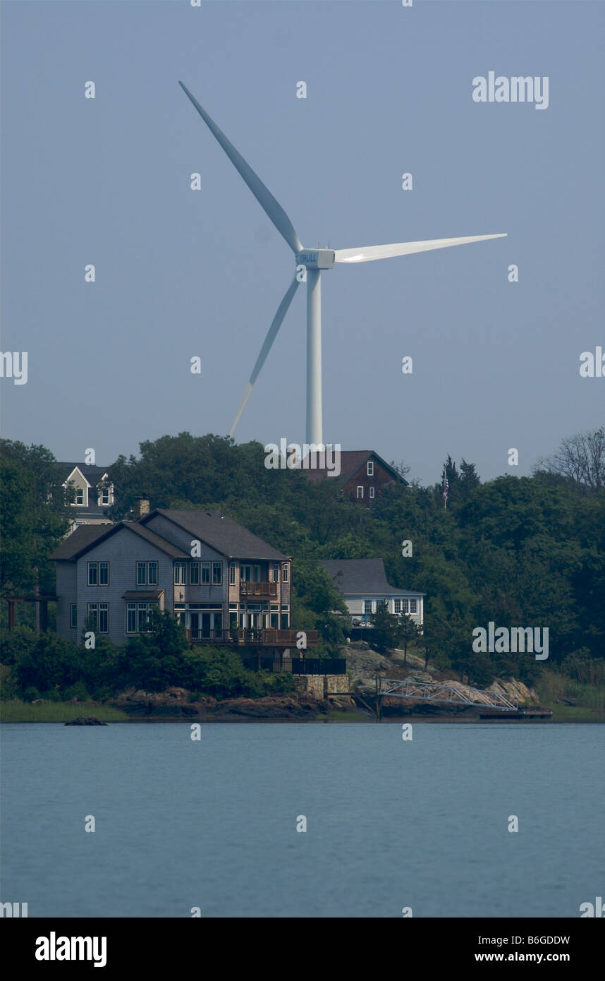 Wind generator towers behind waterfront homes in Hull, an affluent surburb of Boston