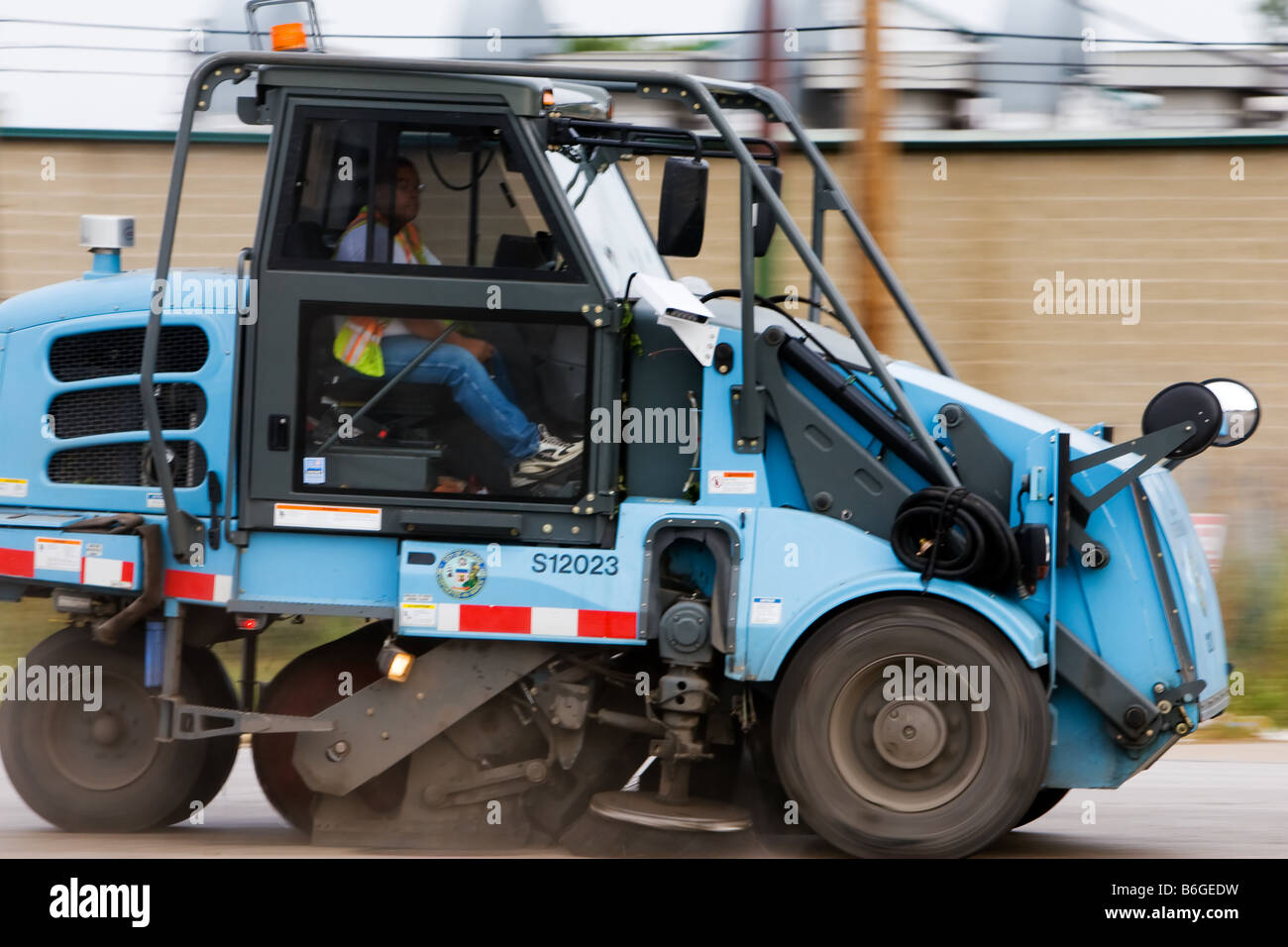 A City of Chicago street sweeper goes about it's cleaning duties Stock