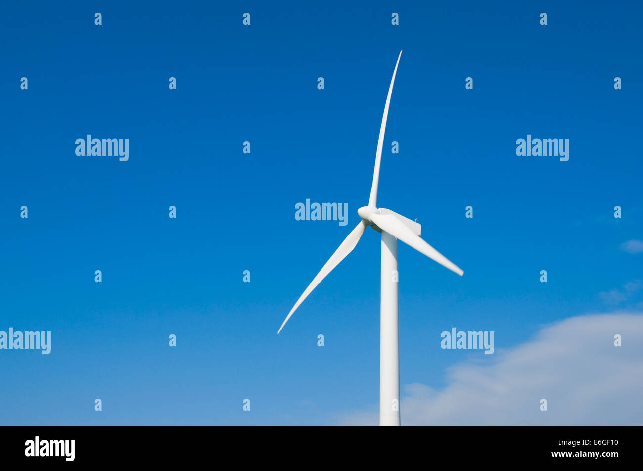 A Wind Turbine Against a Bright Blue Sky Stock Photo - Alamy