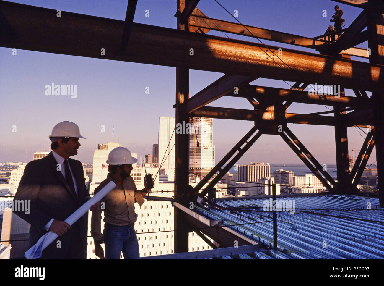 High Rise Building under construction, steel workers, walking on steel beams,supervisor on site, Miami. Stock Photo