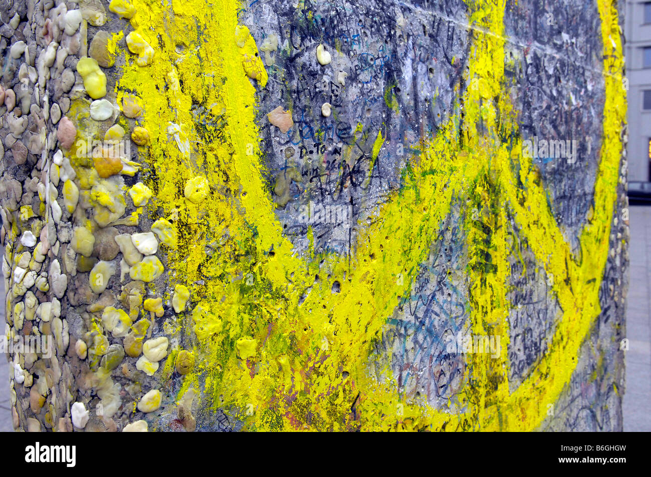 yellow peace sign berlin wall chewing gum Stock Photo