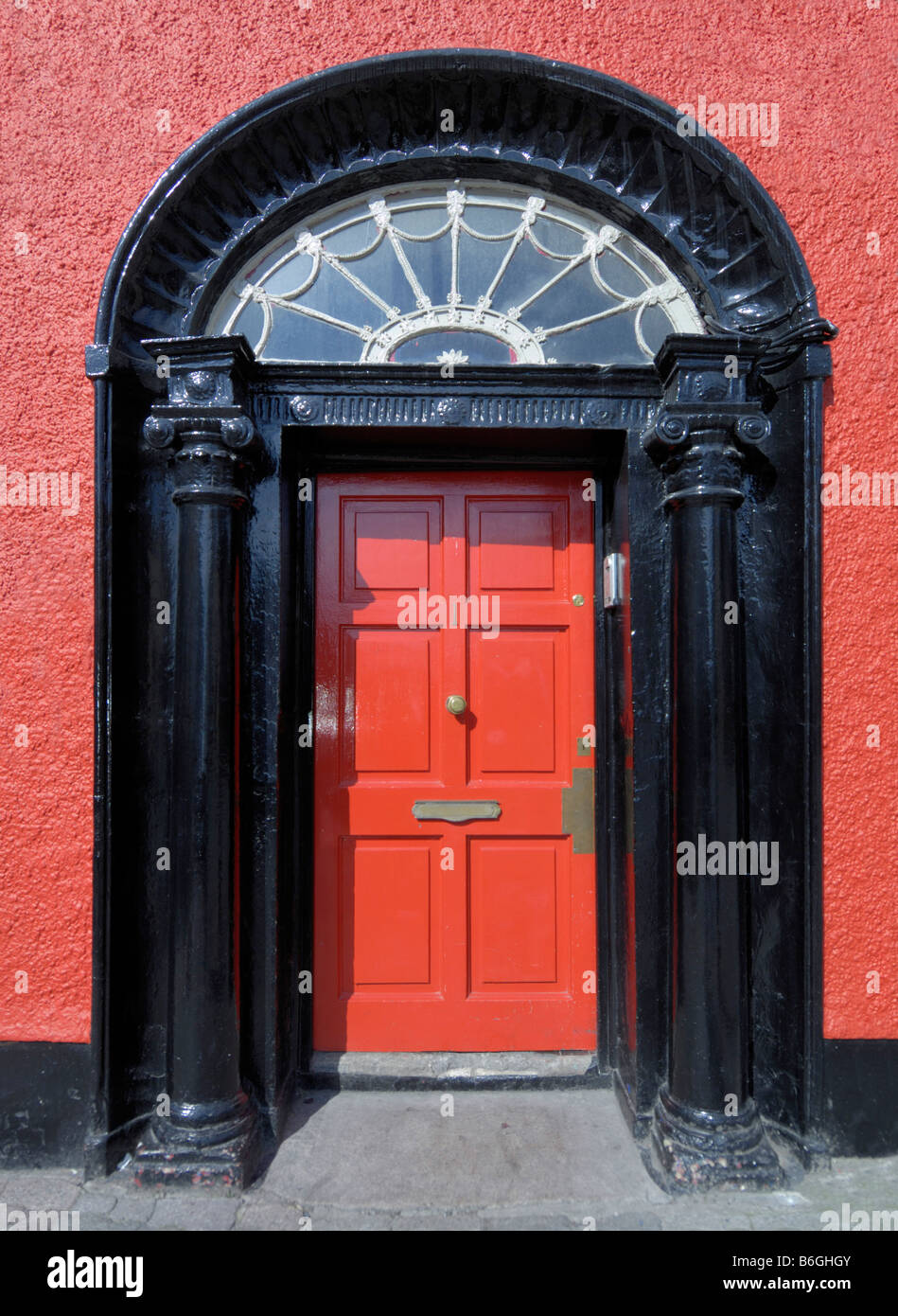 Red door entrance arched Stock Photo