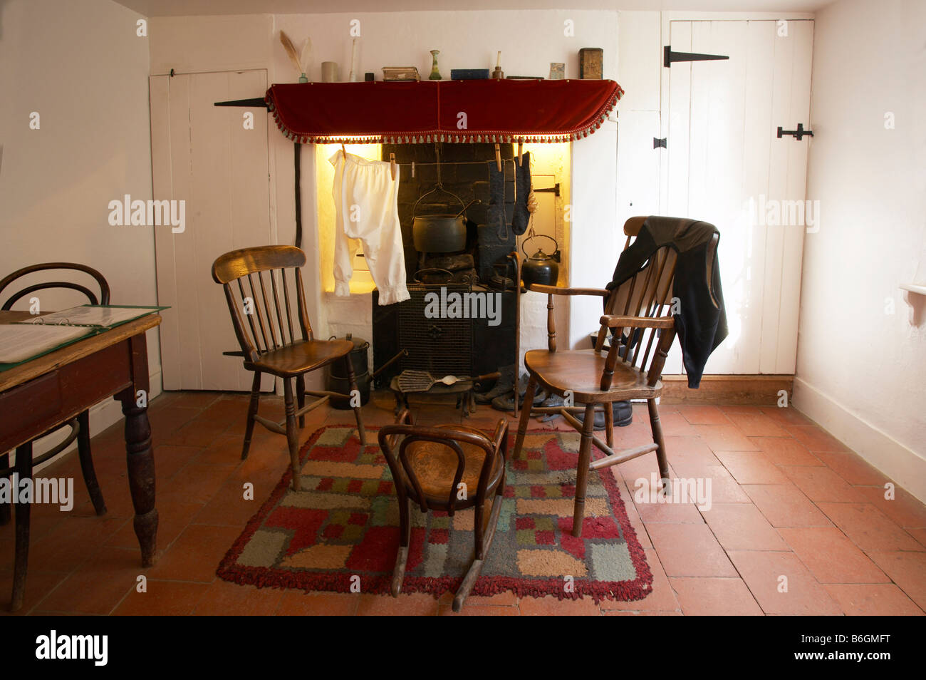 Old fashioned traditional living room and country fire place at a former  marshmans cottage on the Norfolk Broads Stock Photo - Alamy