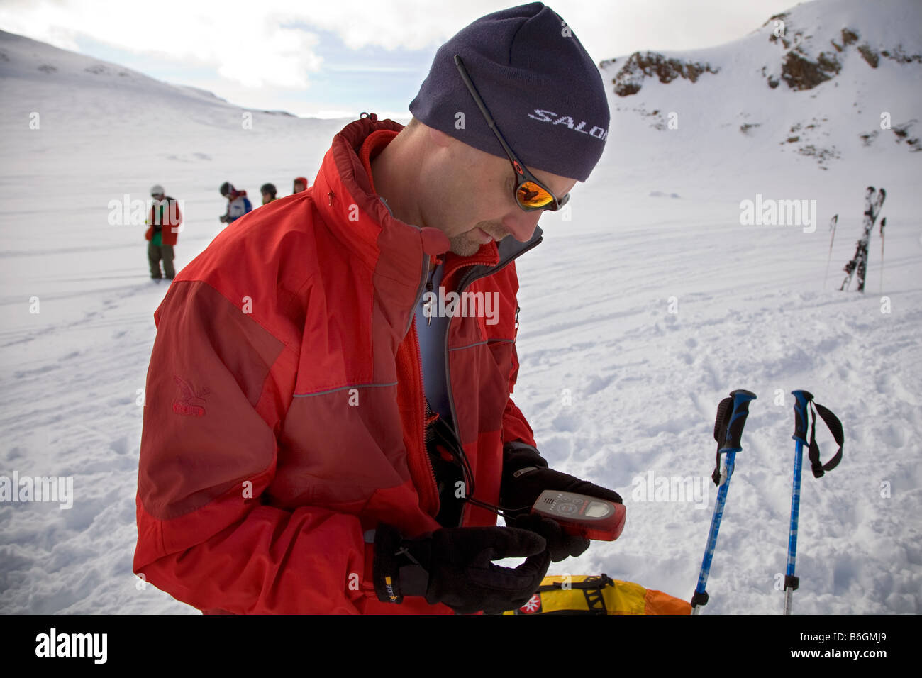 A man trains with a transmitter on the Stubaier glacier in Austria The transmitters are used to locate people lost in avalanches Stock Photo