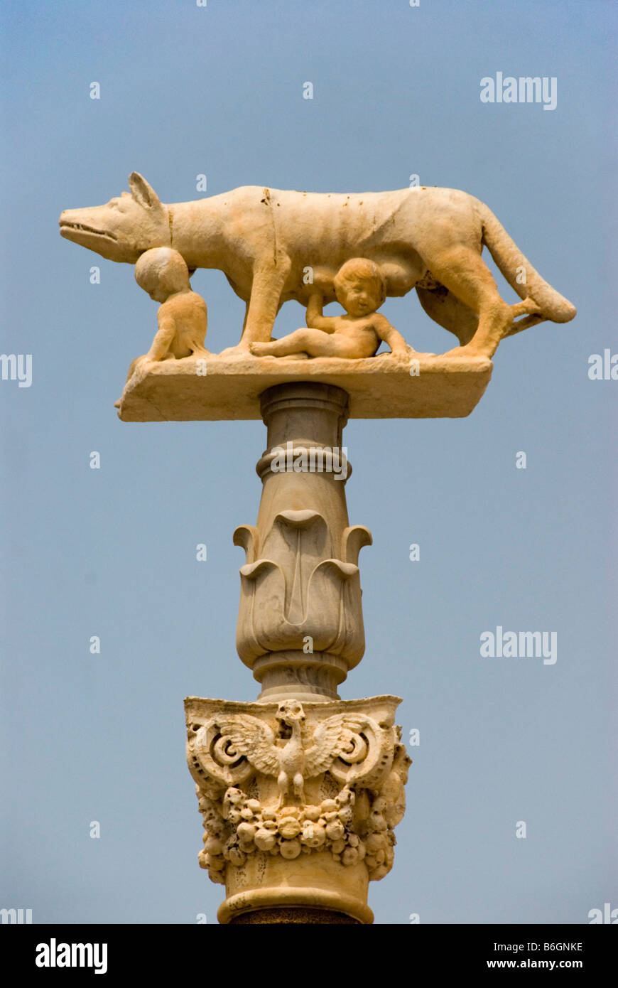 Statue of a wolf feeding Romulus and Remus in Siena, Tuscany Italy