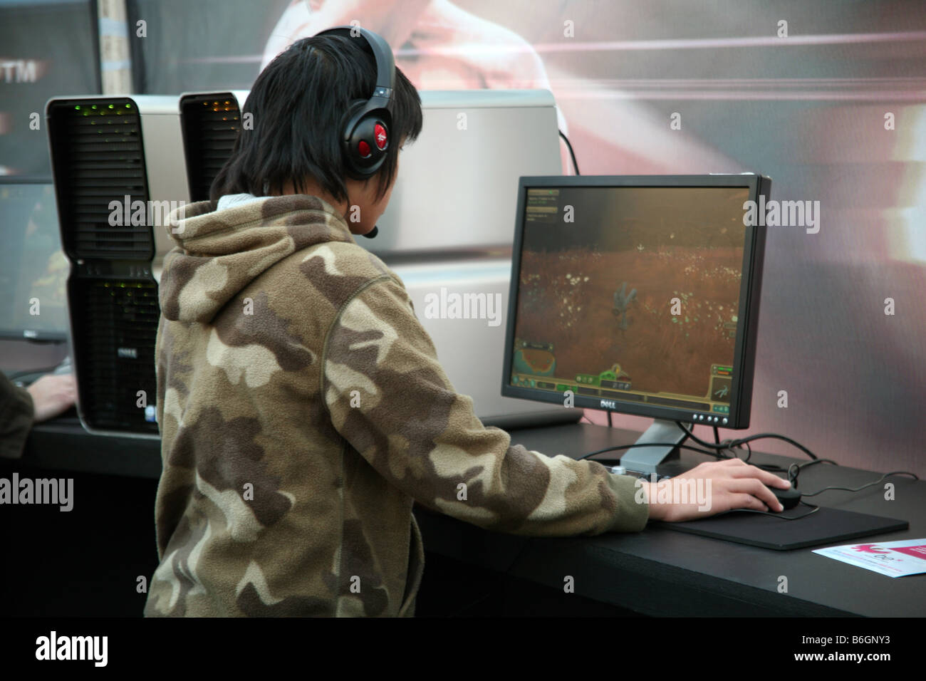 Boy playing computer game at London games show Stock Photo