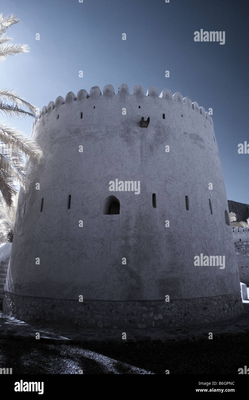 Infrared picture of Khasab Castle, Musandam, Oman using false colour and channel swapping Stock Photo