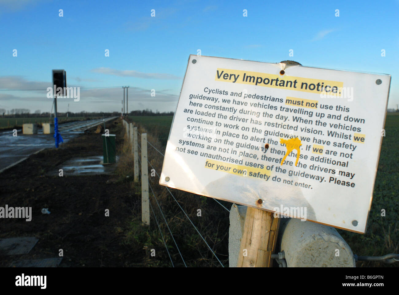 Sign advising pedestrians and cyclists not to enter an area where the Cambridgeshire Guided Busway is under construction. Stock Photo