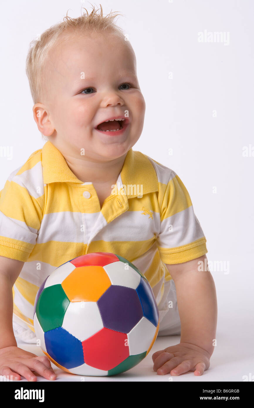 Toddler playing with a ball Stock Photo Alamy