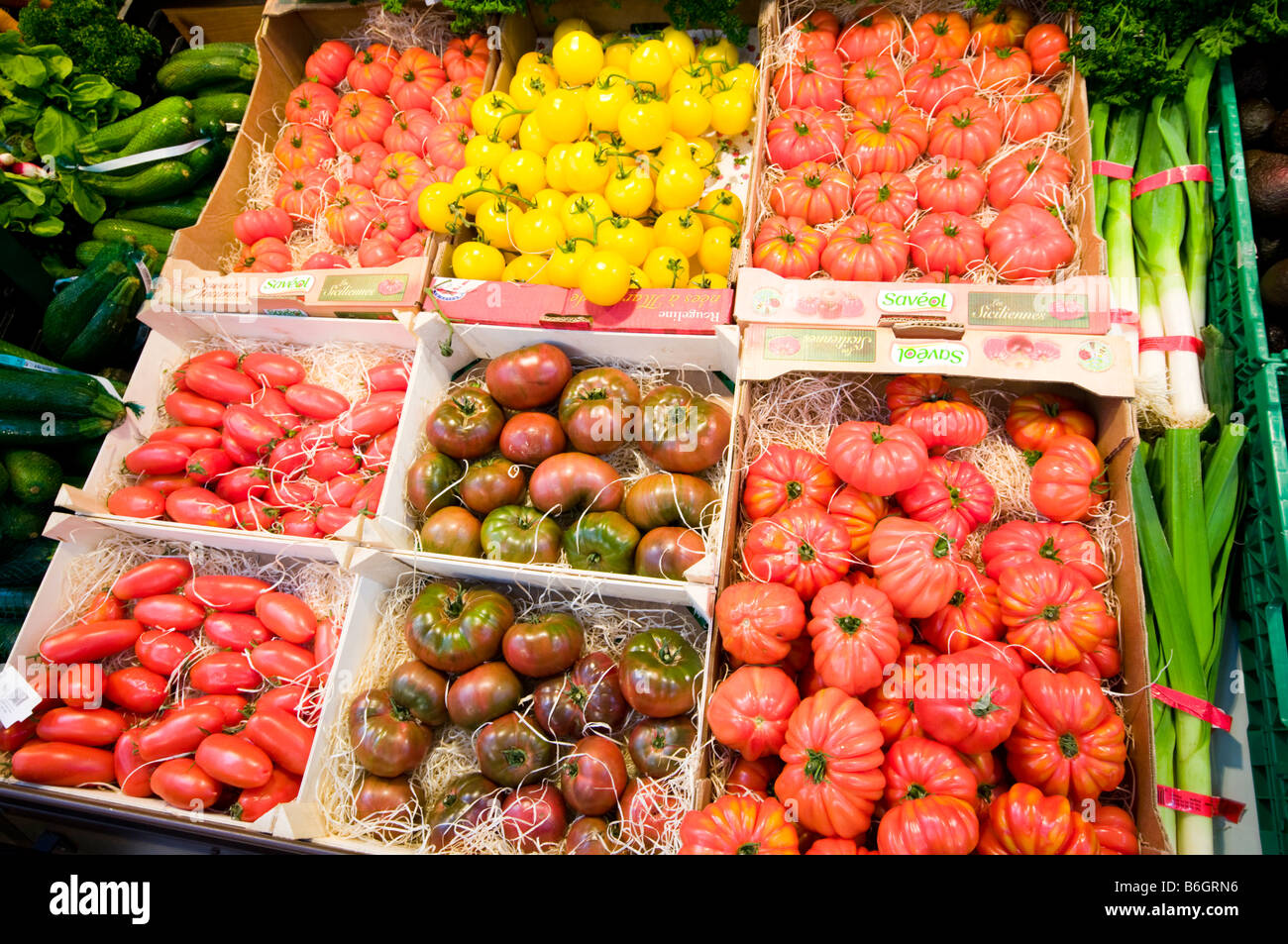 Display of various types of unusual tomatos in French Supermarket Stock Photo