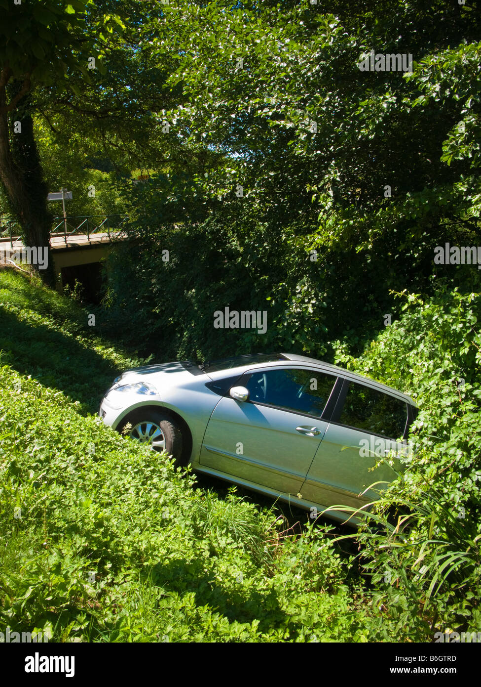 Mercedes A class accidentally reversed into a ditch France Europe Stock Photo