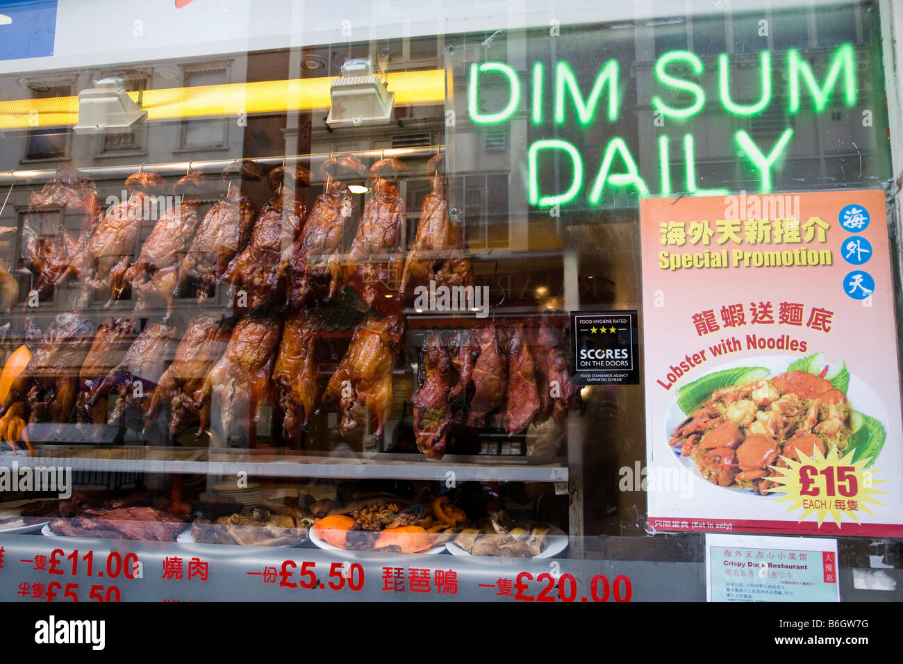 Various food dishes are displayed in this shop window in China Town