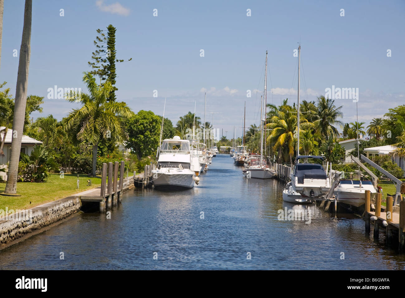 Side canals with waterfront homes and boats at docks along the New