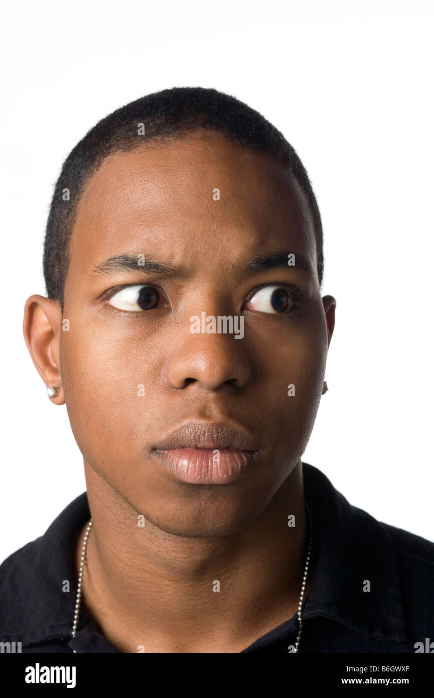 Startled young man looking askance Stock Photo