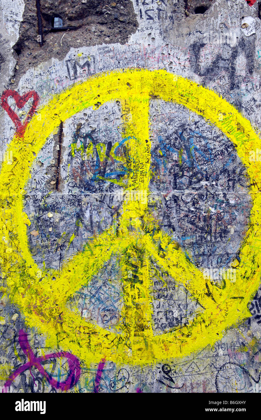 yellow peace sign berlin wall Stock Photo