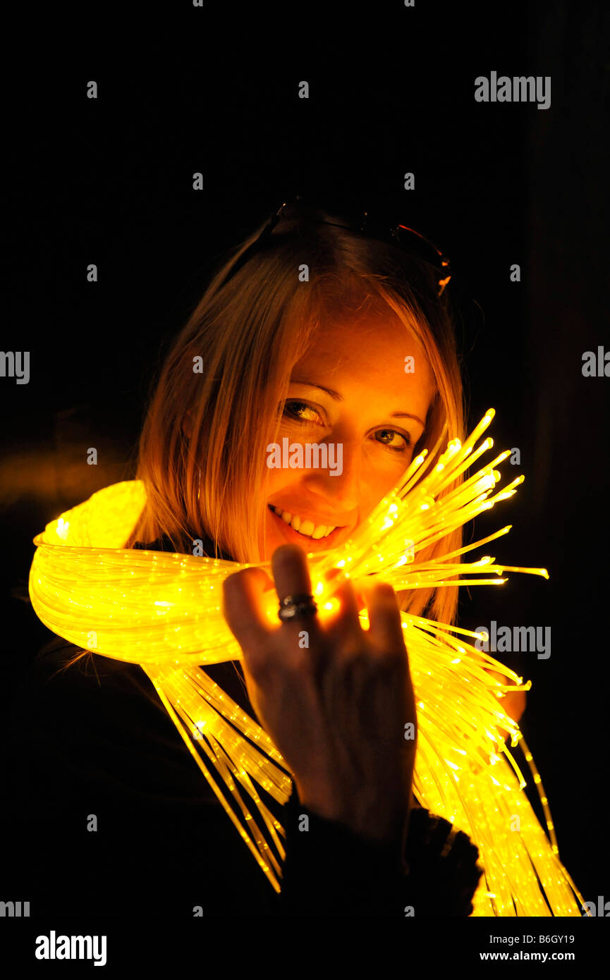 Girl wrapped in fibre optic light rope Stock Photo Alamy