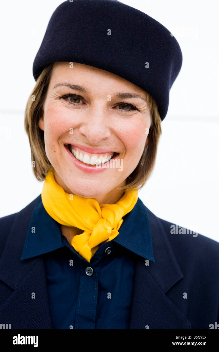 Stewardess smiling at viewer Stock Photo Alamy