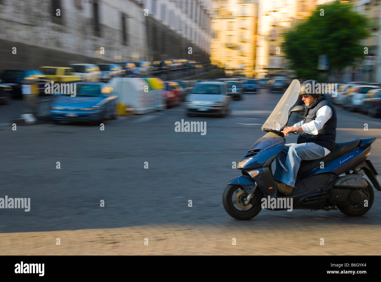 Man on a moped in centro storico quarter of Naples Italy Europe Stock Photo