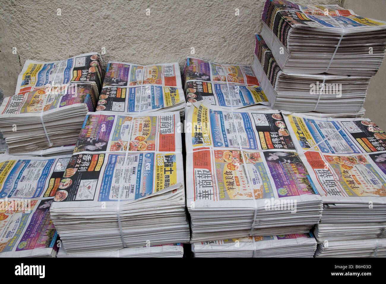Chinese language newspapers on sale in Gerrard Street, Soho in London's China Town, England. Stock Photo