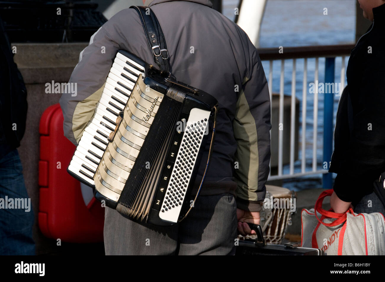 A street entertainer with an accordeon, The South Bank, London, UK