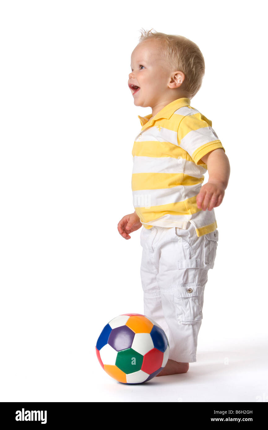 Toddler playing with a ball Stock Photo Alamy
