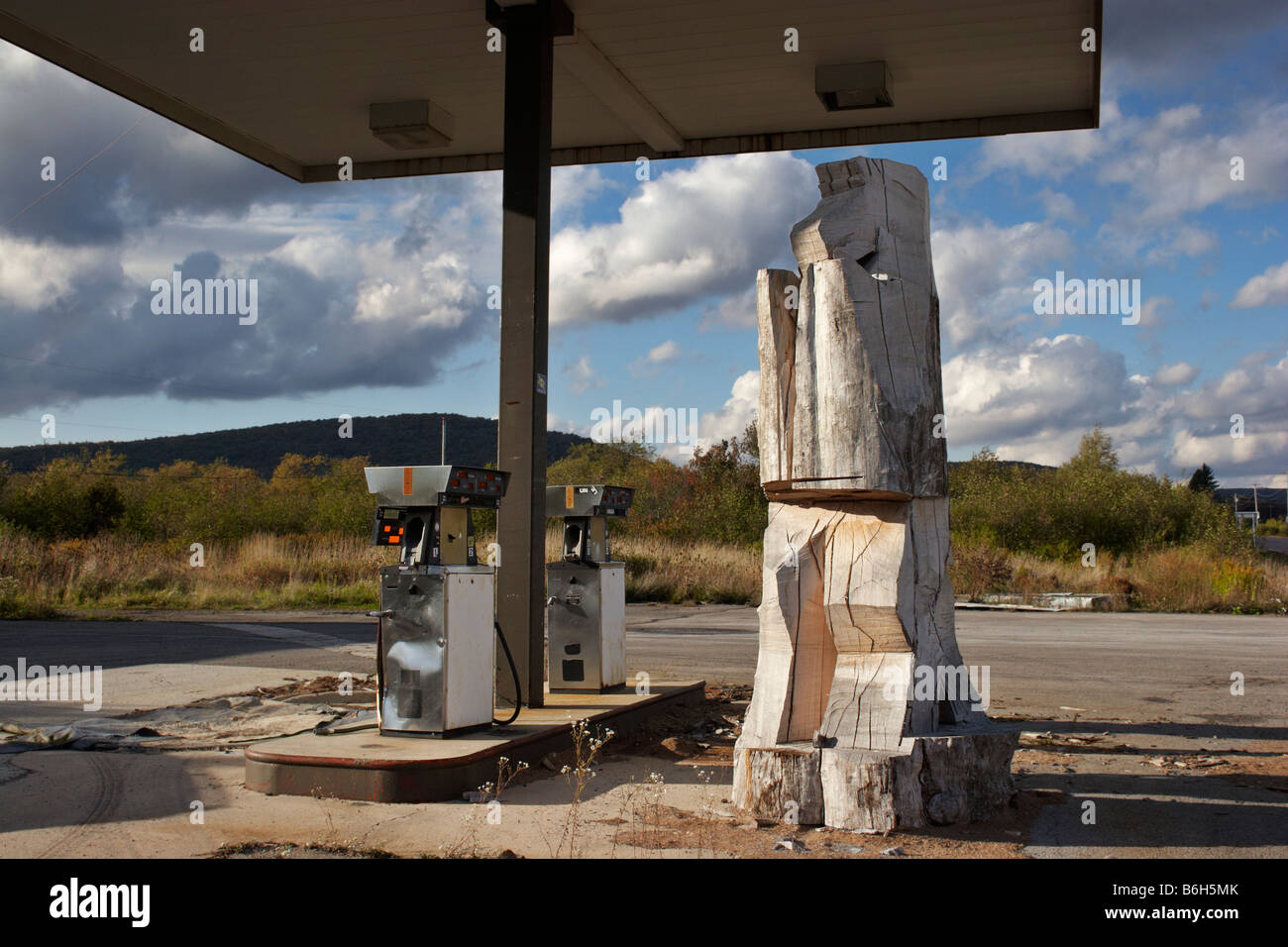 A large mysterious carving in progress on the grounds of an abandoned gas station Davis West Virginia Stock Photo
