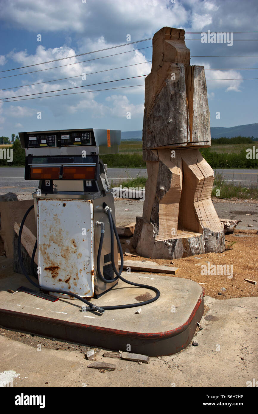 A large mysterious carving in progress on the grounds of an abandoned