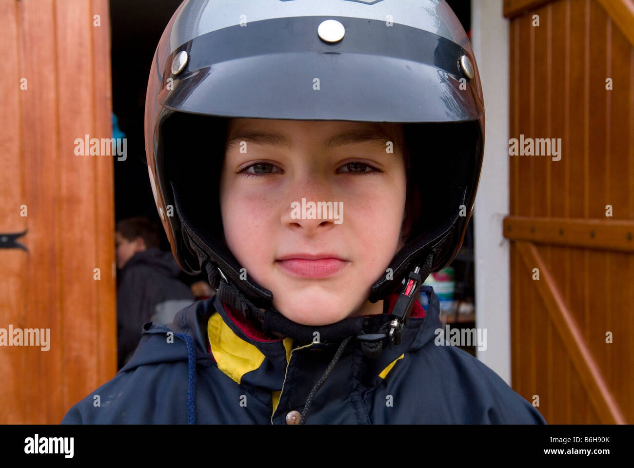 Young boy wearing motorcycle helmet Stock Photo - Alamy
