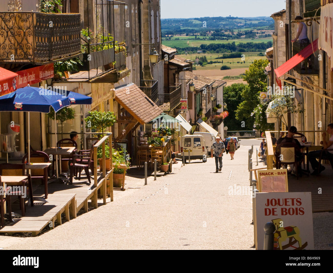 French hilly medieval street in the town of Monflanquin, Lot et Garonne, Southwest France Europe Stock Photo