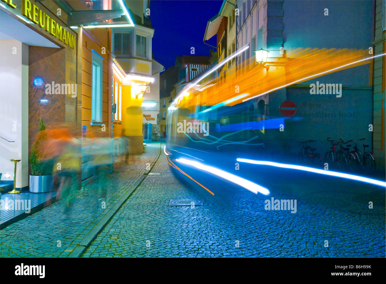 Blur of bus in a narrow street, Lindau Island, Lake Constance, Germany Stock Photo
