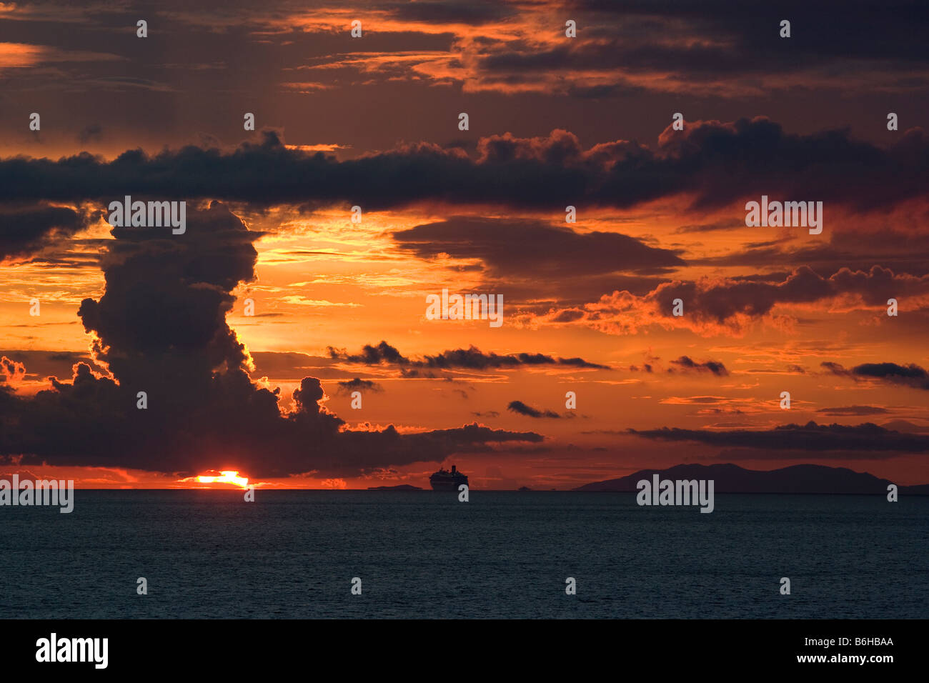 Cruise ship sailing into Sunset Stock Photo - Alamy