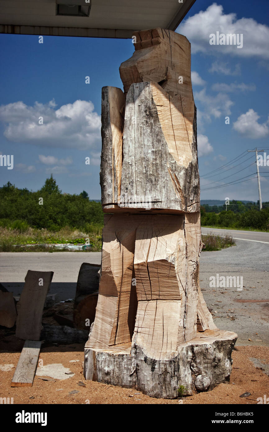 A large mysterious carving in progress on the grounds of an abandoned