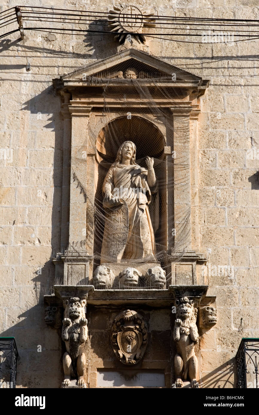 Medieval Christian niche of saint at a building in Malta. Stock Photo