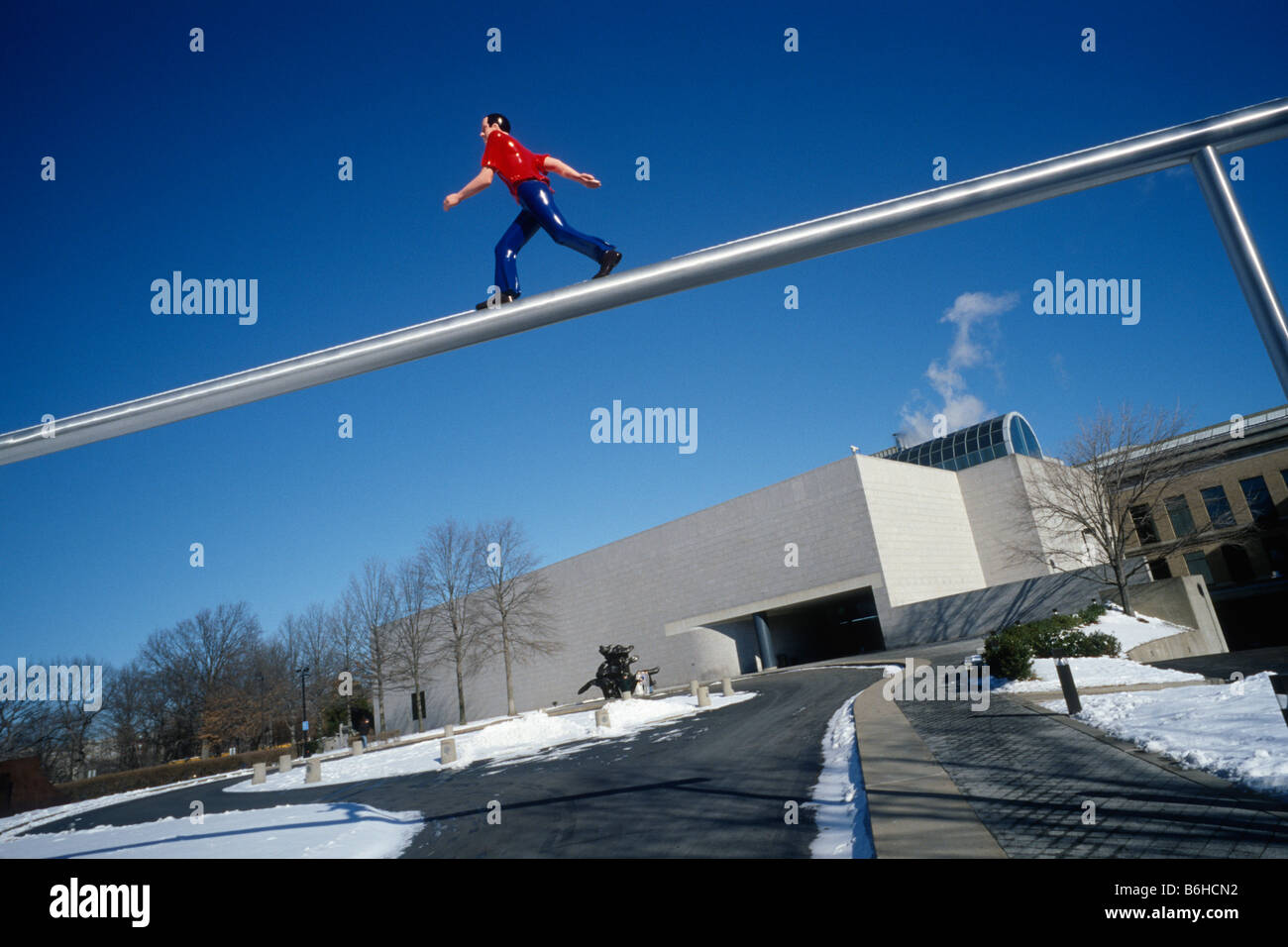 Boston. USA. West Wing of the Boston Museum of Fine Arts & Jonathan Borofsky's Walking Man sculpture. Stock Photo